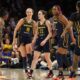 Indiana Fever players on the court during an intense WNBA game.