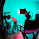 A creative representation of a tellyplay production process showcasing a script, a director's chair, and television camera on set.