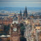 A picturesque view of Edinburgh Castle and the city skyline during a sunny day.