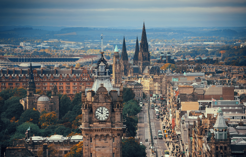 A picturesque view of Edinburgh Castle and the city skyline during a sunny day.